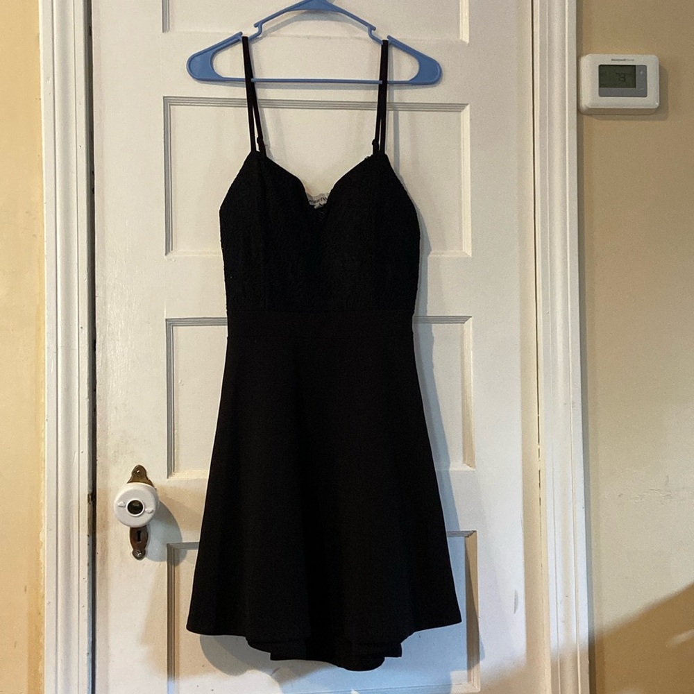 I am selling a short all black dress